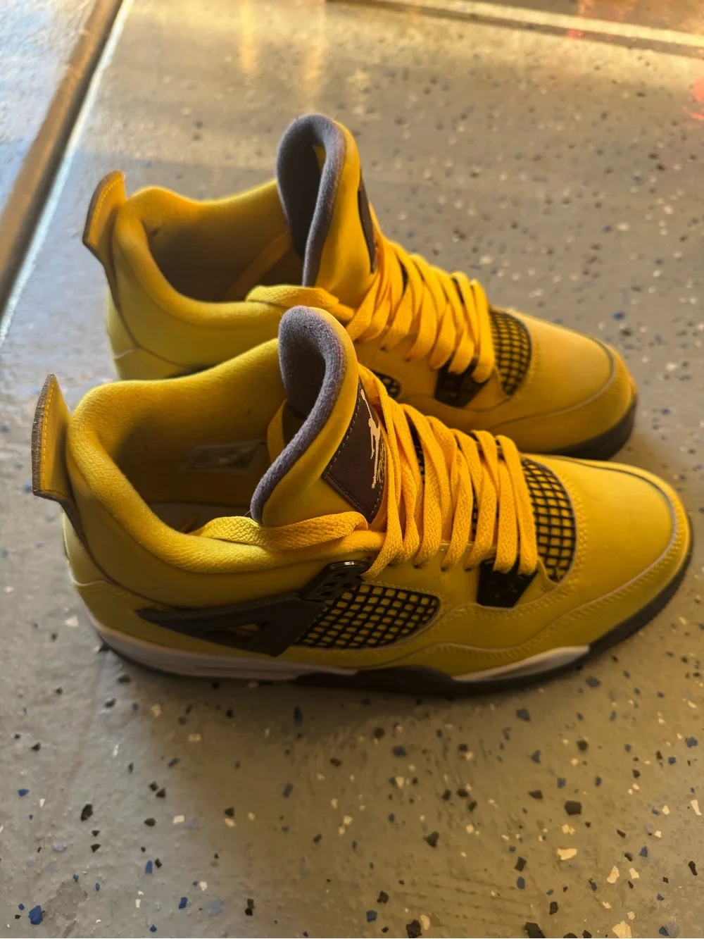 Jordan Yellow and Black Retro 4 Sneakers “Yellow Lightning”